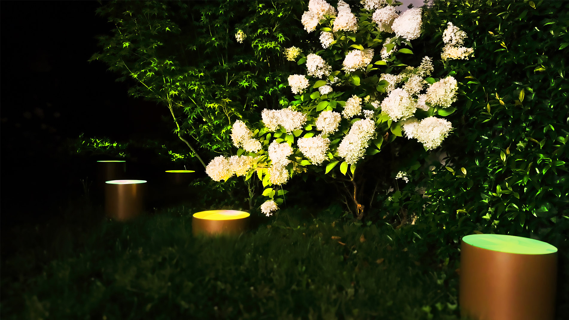 Outdoor lighting designed by the artist Guillaume Bottazzi. Night view.